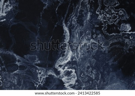 Marble blue background. Porcelain stoneware is dark blue.Texture of stone slab. Ceramic tiles for finishing floor.Graphic abstract background. Ceramic countertop.