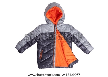 Winter jacket isolated. A stylish black warm down jacket with orange lining for the kids isolated on a white background. Childrens wear for winter. Royalty-Free Stock Photo #2413429057
