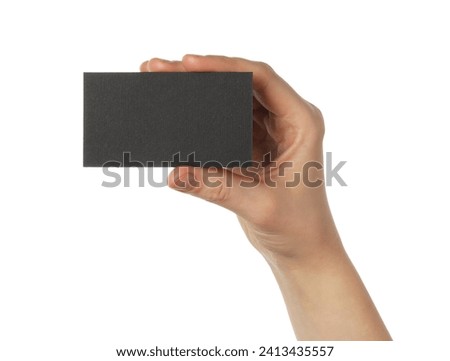 Woman with blank black business card on white background, closeup. Mockup for design