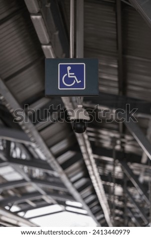 Accessible Elevator with sign. Disabled persons lift near modern apartment facility. The special elevator for the disabled at the entrance to the living house. Equipment with the wheelchair..