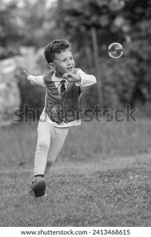 Beautiful baby boy with child soap bubbles posing photographer for cool photo, cadre consisting of baby boy in child soap bubbles and caucasian expression face, healthy baby boy on child soap bubbles