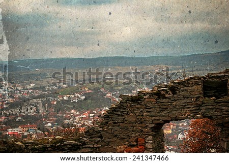 Aerial view of the city of Deva, Romania, from the ruins of a citadel built in 1250 and located at an altitude of 371 meters above the city. Image digitally manipulated in the form of old photos.