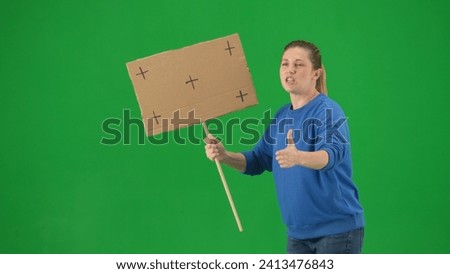 Female activist on green screen shouting protest slogans close up. Advertising, promo, chroma key.
