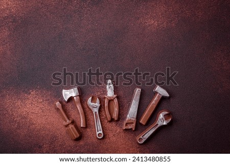 Tools and inscriptions symbolizing repairs or a garage and its attributes on a plain background. Background for your design