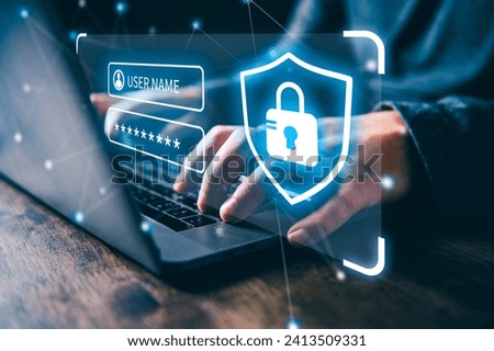 Hands typing on laptop with digital security concept overlay, featuring shield and padlock icons. Royalty-Free Stock Photo #2413509331