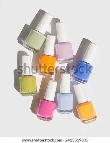 Set of pastel nail polish on white background with shadow