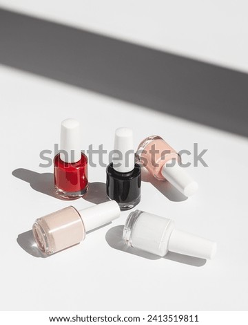Set of nail polish on white background with shadow