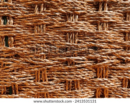 Threading pattern in basket woven cloth, golden threads