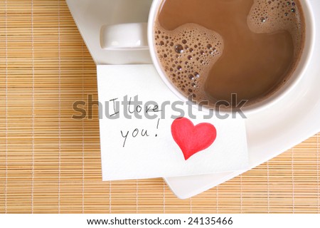 a love note with a cup of coffee on the table