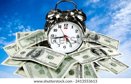 "Money measures value, facilitating transactions. Time, irreplaceable and finite, defines life's progression, shaping experiences and priorities." Royalty-Free Stock Photo #2413553613