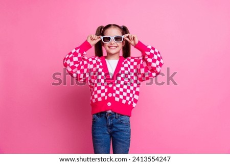 Photo of adorable lovely carefree girl wearing stylish clothes hand holding 3d glasses watching cartoon isolated on pink color background