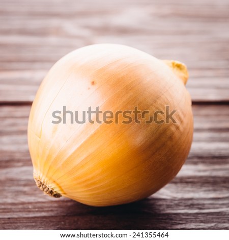 Onion on wood background - vintage effect style pictures