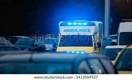 Fast moving ambulance car of emergency medical service on busy city street. Themes health care, rescue and urgency.
 Royalty-Free Stock Photo #2413569527