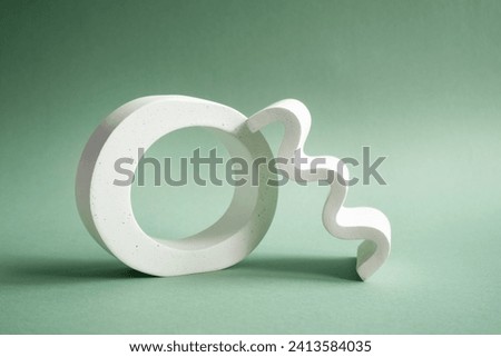 white geometric shapes on a green background with shadows.