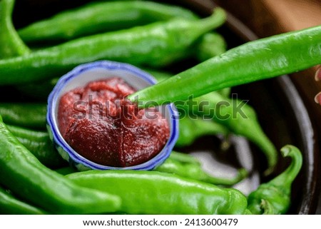 Close-Up 4K Ultra HD Image of Fresh Green Pepper with Red Pepper Paste Dipping Sauce - Culinary Fusion