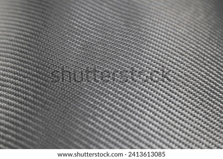 Gray Fiber glass Fabric textile fibre for bulletproof vest body armor jacket production Royalty-Free Stock Photo #2413613085