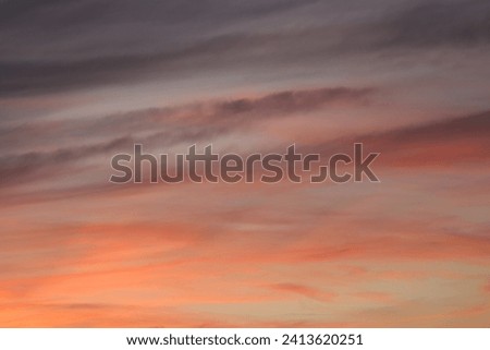 A breathtaking sunset sky painted with a palette of deep reds and oranges, a dramatic backdrop that evokes a sense of calm and wonder. High quality photo