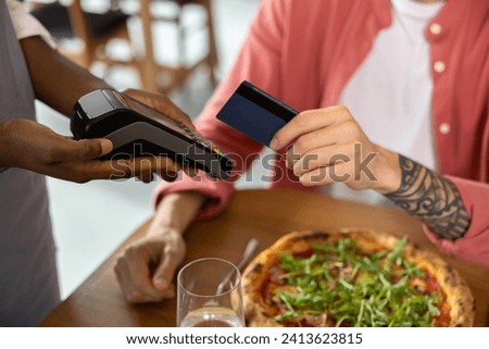 Close up picture of mans hand holding credit card
