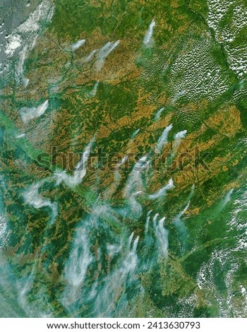 Fires and smoke in Central Russia. Fires and smoke in Central Russia. Elements of this image furnished by NASA. Royalty-Free Stock Photo #2413630793