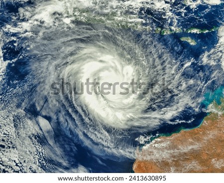 Tropical Cyclone Marcus 15S off Western Australia. Tropical Cyclone Marcus 15S off Western Australia. Elements of this image furnished by NASA. Royalty-Free Stock Photo #2413630895