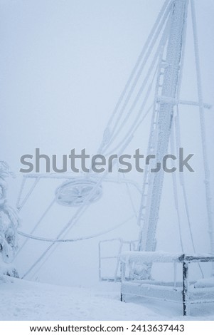 Snowy picture of mountain lift in Czech Republic