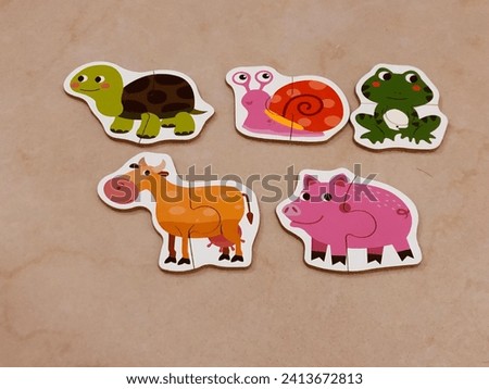 animal shape puzzle, tortoise, snails, frogs, cows and pigs