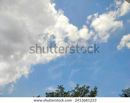 blue sky picture scattered white clouds Buildings that decorate the sky to life Nature and man-made things
