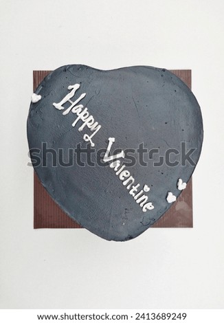 Gray love shaped cake for Valentine's celebration on a white background.