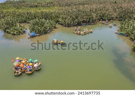 Tourists from Thailand, Korea, America, China and Japan are relax and experiencing a basket boat tour at the coconut water ( mangrove palm ) forest in Cam Thanh village, Hoi An,Quang Nam,Vietnam