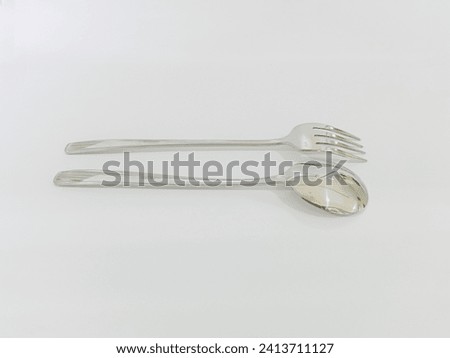Top view of stainless steel spoon and fork, Satisfying, isolated on white, Suitable for creative graphic design Mockup
