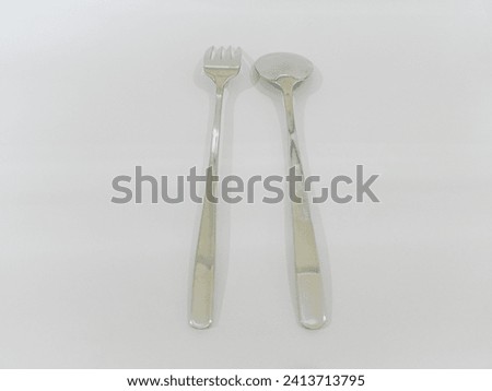 Top view of stainless steel spoon and fork, it means finished, isolated on white, Suitable for creative graphic design Mockup