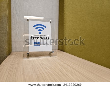 Free Wi Fi sign on Wooden Table in Nagasaki, Japan.
