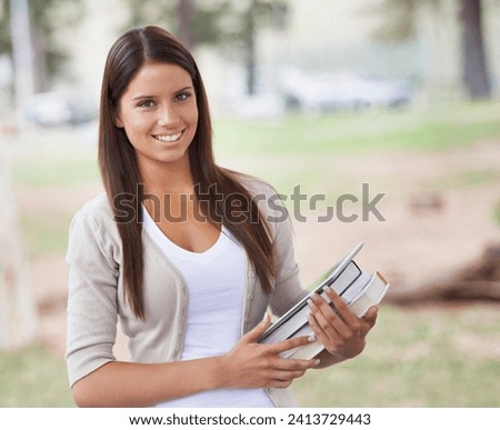 Student, portrait and happy on campus in park, technology and education with books for studying. University, smile or face for positive in outdoor nature, tablet or learning in commitment in college