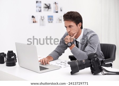 Photographer, thinking and editing on computer in office with technology, software and work. Professional, editor and creative person learning on laptop with photoshoot results or cinematography