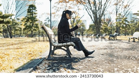 Asian woman, walking and relax on park bench with phone for social media, communication or networking. Female person sitting with mobile smartphone for online search, streaming or break in nature