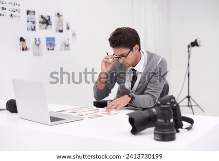 Photographer, working and editing photoshoot in office with technology, software and thinking. Professional, editor and creative person with media production, process and results of cinematography