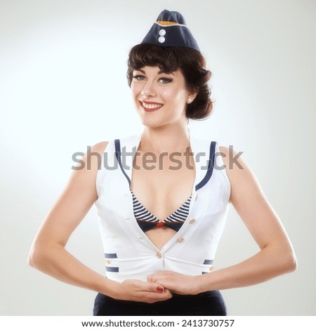 Travel, happy air hostess and portrait of woman in studio isolated on a white background in Spain. Fashion, flight attendant and face of retro sailor person, pin up girl and stewardess model in hat
