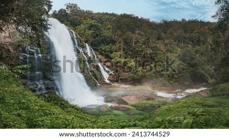 Majestic Wachirathan Waterfall in Doi Inthanon National Park, Chiang Mai, Thailand. Panorama Royalty-Free Stock Photo #2413744529