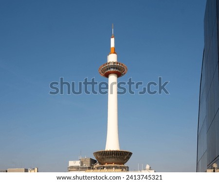 Kyoto Tower against a backdrop of azure skies in Japan. A iconic landmark that stands tall and proud and where you can have a panoramic view of Kyoto’s skyline. 
