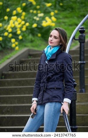 Portrait of an elegant caucasian Woman standing outdoors. Lifestyle image.