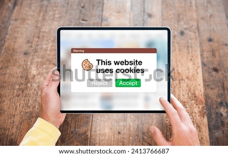 This website uses cookies warning pop-up window on tablet's internet browser Royalty-Free Stock Photo #2413766687