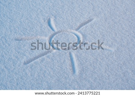 Sun drawing in snow on sunny day