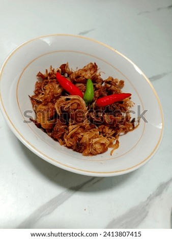 Manday or Mandai is a type of alternative dish from the South Kalimantan region, namely fried Cempedak fruit skin. Royalty-Free Stock Photo #2413807415