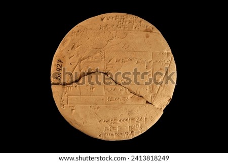 Ancient Babylon cuneiform tablet. Oldest clay tablet in the history of geometry in Istanbul Archaeological Museum in Turkey. Dated to 1900 and 1600 BC. Royalty-Free Stock Photo #2413818249
