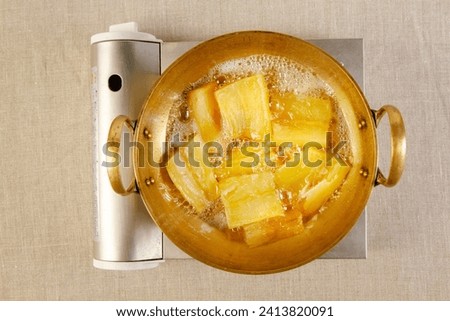 Candied yams, sweet potatoes, yellow, glazed, sugary, delicious, side dish, homemade, comfort food, cooking Royalty-Free Stock Photo #2413820091
