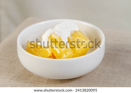 Candied yams, sweet potatoes, yellow, glazed, sugary, delicious, side dish, homemade, comfort food, cooking Royalty-Free Stock Photo #2413820095