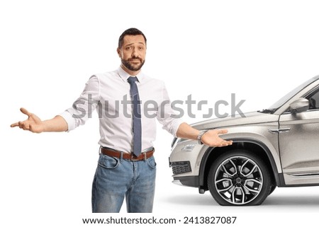 Man standing in front of a car with a flat tire isolated on white background Royalty-Free Stock Photo #2413827087