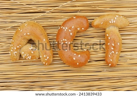 The buns in the shape of the word "act".