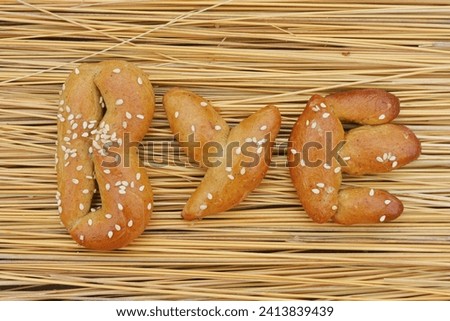The buns in the shape of the word "bye".