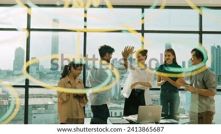 Group of professional happy business team high five with colleagues at table. City view. Diverse business team clapping hands to celebrate their success start up project. Moving camera. Tracery Royalty-Free Stock Photo #2413865687